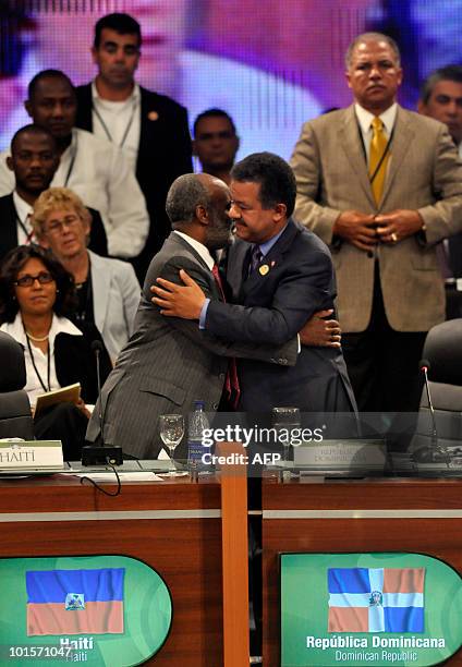 Dominican president Leonel Fernandez and Haiti's Rene Preval greet each other during the World Summit for the Future of Haiti in Punta Cana,...