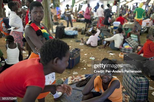 Unidentified girls dress and prepare before a traditional Reed dance ceremony at the Royal Palace on August 30 in Ludzidzini, Swaziland. About 80.000...