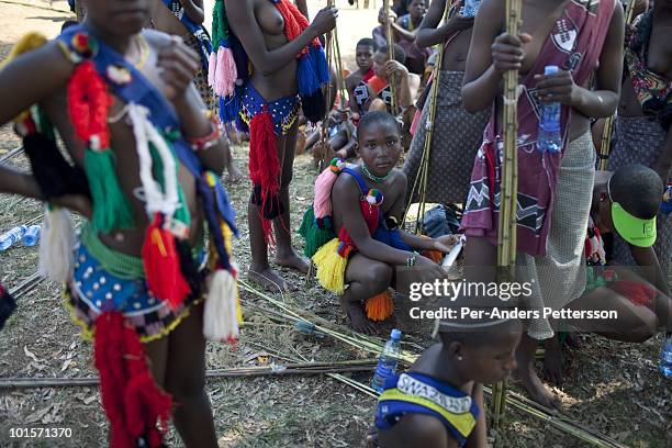 Young girls wait to dance at a traditional Reed dance ceremony at the Royal Palace on August 30 in Ludzidzini, Swaziland. About 80.000 virgins from...