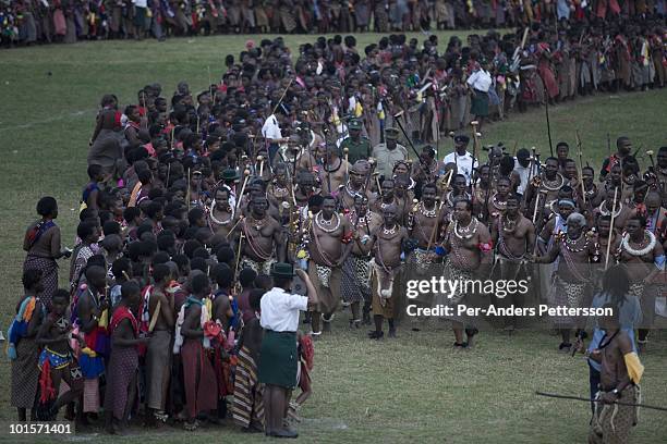 King Mswati III dances in front of young virgins at a traditional Reed dance ceremony at the stadium at the Royal Palace on August 31 in Ludzidzini,...