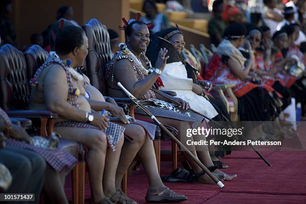 King Mswati III greets spectators at a traditional Reed dance ceremony at the stadium at the Royal Palace on August 31 in Ludzidzini, Swaziland....