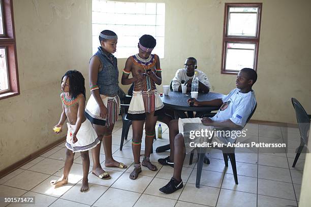 Unidentified youth socialize at the Royal Palace on August 31 in Ludzidzini, Swaziland. About 80.000 virgins from all over the country attended this...