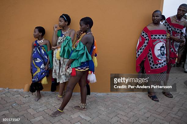 Unidentified girls dress and prepare before a traditional Reed dance ceremony at the Royal Palace on August 30 in Ludzidzini, Swaziland. About 80.000...