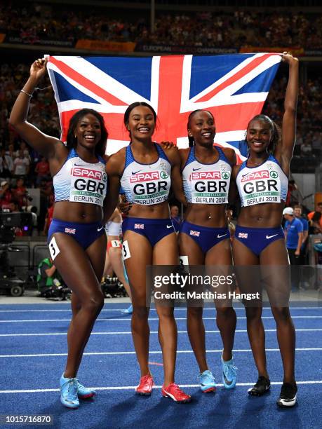 Asha Philip, Imani Lansiquot, Bianca Williams and Dina Asher-Smith of Great Britain celebrate winning gold competes in the Women's 4x100 metres relay...