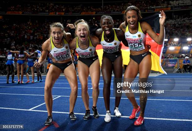 Lise Marie Kwayie, Gina Lueckenkemper, Tatjana Pinto and Rebekka Haase of Germany celebrate after winning the bronze medal in the Women's 4x100...