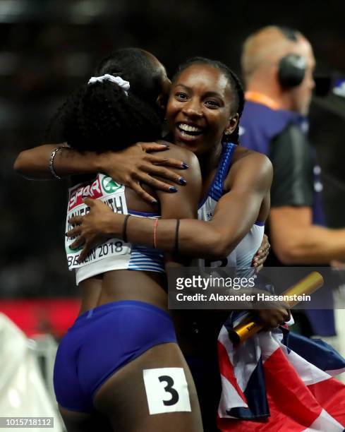 Bianca Williams and Dina Asher-Smith of Great Britain celebrate winning gold in the Women's 4x100 metres relay final during day six of the 24th...