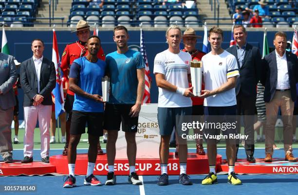 Henri Kontinen of Finland and John Peers of Australia celebrate victory in the doubles final match against Raven Klaasen of South Africa and Michael...