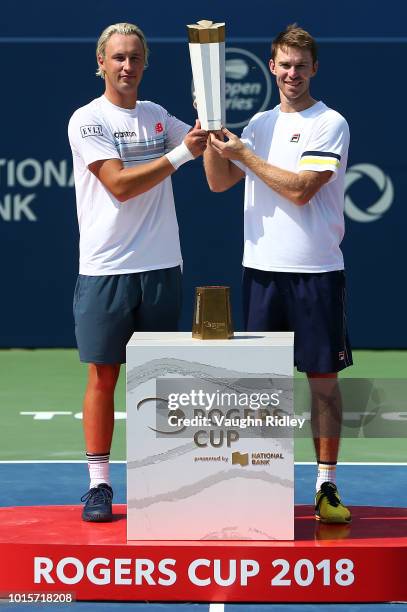 Henri Kontinen of Finland and John Peers of Australia celebrate victory following the doubles final match against Raven Klaasen of South Africa and...