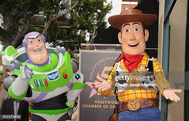Buzz Lightyear and Woody attend the Hollywood Walk Of Fame star ceremony honoring Randy Newman on June 2, 2010 in Hollywood, California.