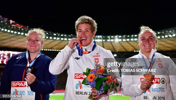 France's Alexandra Tavernier , Poland's Anita Wlodarczyk and Poland's Joanna Fiodorow celebrates on the podium during the medal ceremony for the...