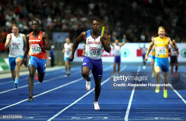 Harry Aiknes-Aryeetey of Great Britain crosses the line to win the gold medal in the Men's 4 x 100m Relay Final during day six of the 24th European...