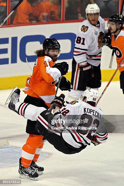 Scott Hartnell of the Philadelphia Flyers checks Tomas Kopecky of the Chicago Blackhawks in Game Three of the 2010 NHL Stanley Cup Final at Wachovia...