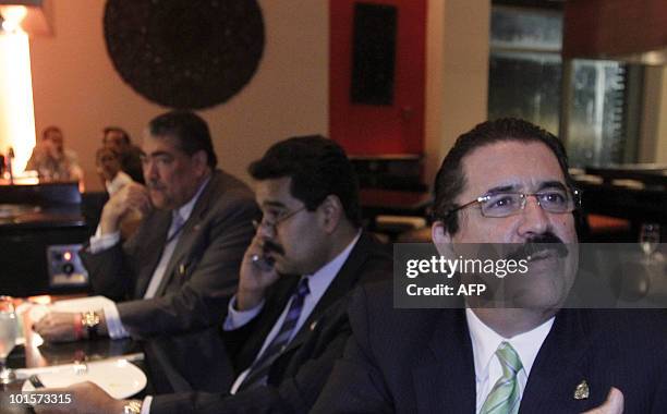 Venezuela's foreign minister Nicolas Maduro and former Honduran President Manuel Zelaya have dinner together at the hotel's restaurant at the end of...