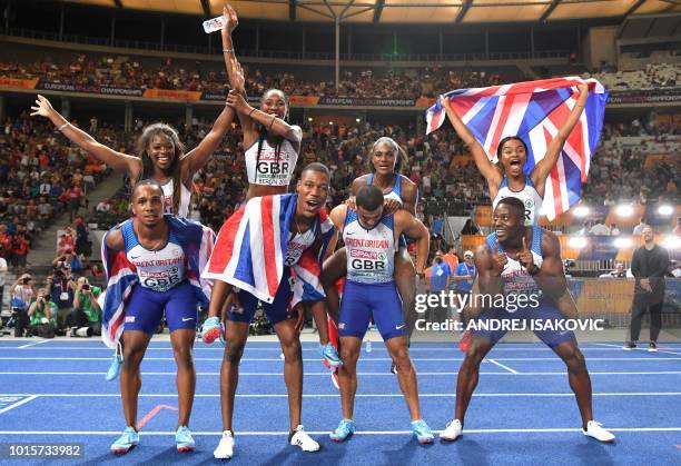 The British men's and women's team pose after the men's 4x100m relay final during the European Athletics Championships at the Olympic stadium in...