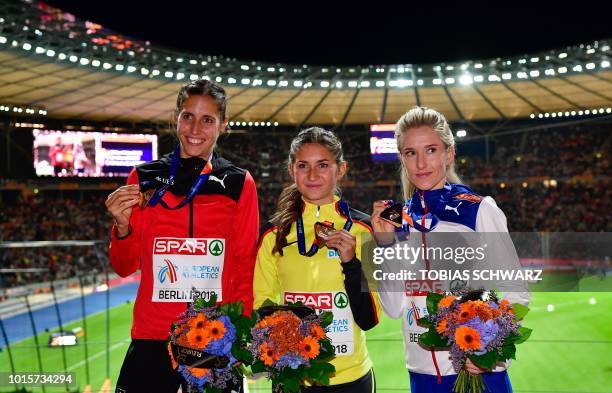 Switzerland's Fabienne Schlumpf , Germany's Gesa-Felicitas Krause and Norway's Karoline Bjerkeli Grovdal celebrate on the podium during the medal...