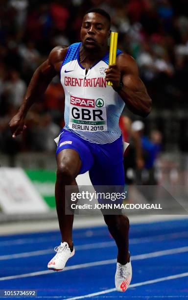 Great Britain's Harry Aikines-Aryeetey crosses the finish line first during the men's 4x100m relay final during the European Athletics Championships...