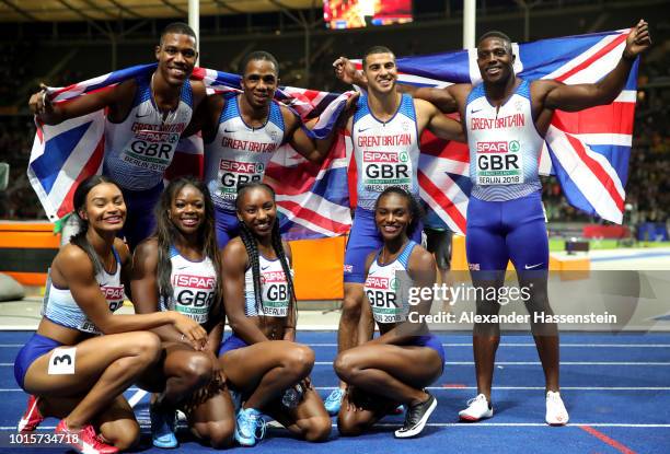 Great Britain athletes celebrate winning gold in their respective 4x100 metres relay finals during day six of the 24th European Athletics...