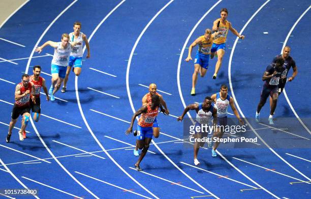 Adam Gemili of Great Britain passes the baton to Harry Aiknes-Aryeetey of Great Britain in the Men's 4 x 100m Relay Final during day six of the 24th...