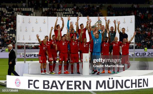 The team of Muenchen celebrate winning the Supercup 2018 after the DFL Supercup 2018 between Eintracht Frankfurt and Bayern Muenchen at...