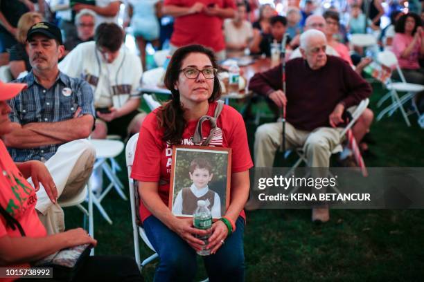 Francine Wheeler, displays a photograph of her son, Sandy Hook Elementary shooting victim Ben Wheeler, at March for our Lives Rally at Fairfield...