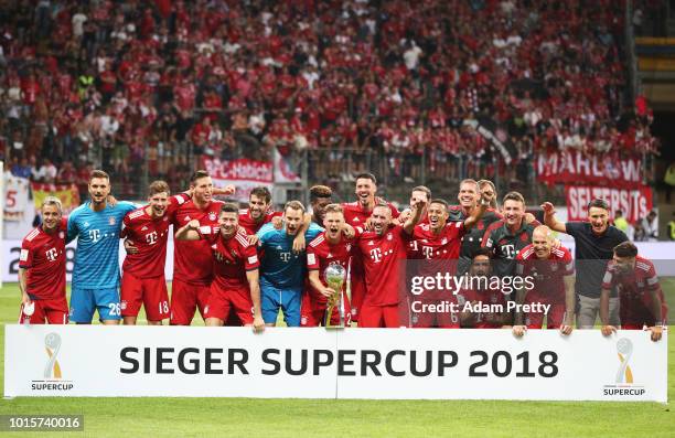 Manuel Neuer of Bayern Munich and his team mates celebrat winning the DFL Supercup 2018 match between Eintracht Frankfurt and Bayern Muenchen at...