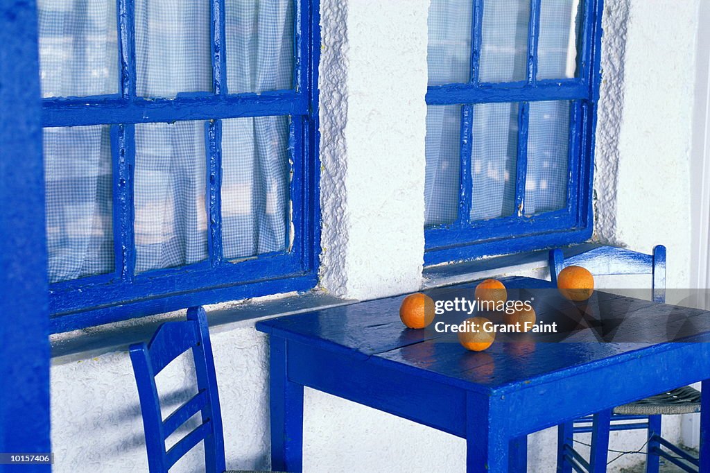 ORANGES ON BLUE CAFE TABLE, GREEK ISLANDS