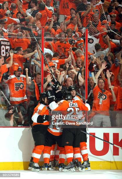 The Philadelphia Flyers celebrate after defeating the Chicago Blackhawks 4-3 in overtime with a goal by Claude Giroux in Game Three of the 2010 NHL...
