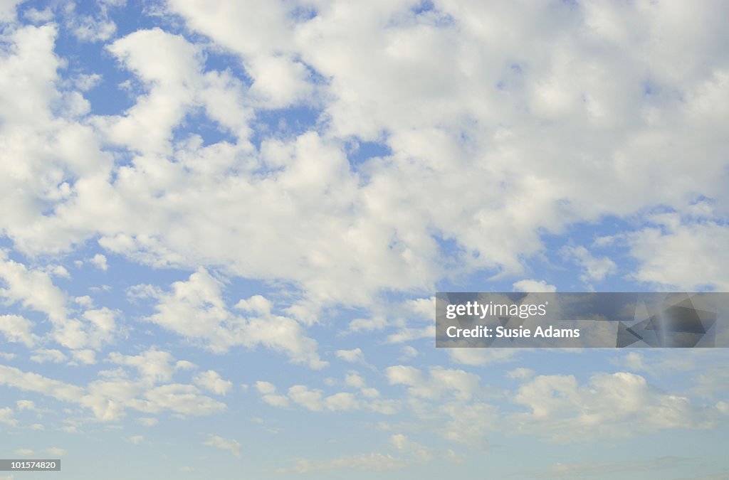 Fluffy white clouds with blue sky