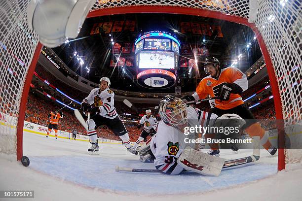 Simon Gagne of the Philadelphia Flyers celebrates the goal made by Scott Hartnell against Antti Niemi Niklas Hjalmarsson of the Chicago Blackhawks in...