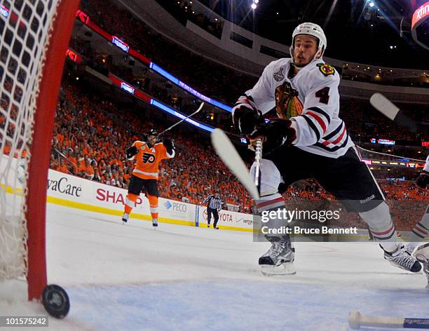 Simon Gagne of the Philadelphia celebrates a goal scored by teammate Scott Hartnell against Antti Niemi and Niklas Hjalmarsson of the Chicago...