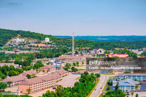 daytime summer aerial view of hwy 76 strip in branson, missouri - 1011957648,1011945618,1011950492,1011960800,1011954950,1011953954,1015768380,1015768366,1015768370,1015768372,1015768382,1015768398,1015768412,1015768410,1015768414,1015768418,1015768438,1015768448,1015768450,1015768488,1015768474,1015768478,1015768504,1015768508,1016083590,1016083634,1016083592,1016083608,1016083686,1016083708,1016083780,1016083774,1016083796,1016083828,1016083994,1016083992,1016083982,1016083980 stock pictures, royalty-free photos & images