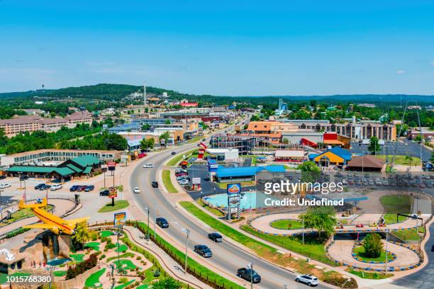 daytime summer aerial view of hwy 76 strip in branson, missouri - missouri stock pictures, royalty-free photos & images