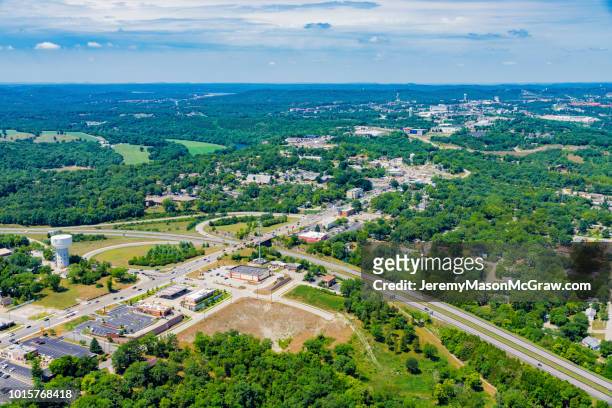 aerial view of hwy 76 and hwy 65 intersection in branson, missouri - 1011957648,1011945618,1011950492,1011960800,1011954950,1011953954,1015768380,1015768366,1015768370,1015768372,1015768382,1015768398,1015768412,1015768410,1015768414,1015768418,1015768438,1015768448,1015768450,1015768488,1015768474,1015768478,1015768504,1015768508,1016083590,1016083634,1016083592,1016083608,1016083686,1016083708,1016083780,1016083774,1016083796,1016083828,1016083994,1016083992,1016083982,1016083980 stock pictures, royalty-free photos & images