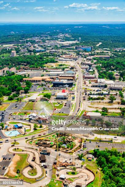 daytime summer aerial view of hwy 76 strip in branson, missouri - 1011957648,1011945618,1011950492,1011960800,1011954950,1011953954,1015768380,1015768366,1015768370,1015768372,1015768382,1015768398,1015768412,1015768410,1015768414,1015768418,1015768438,1015768448,1015768450,1015768488,1015768474,1015768478,1015768504,1015768508,1016083590,1016083634,1016083592,1016083608,1016083686,1016083708,1016083780,1016083774,1016083796,1016083828,1016083994,1016083992,1016083982,1016083980 stock pictures, royalty-free photos & images