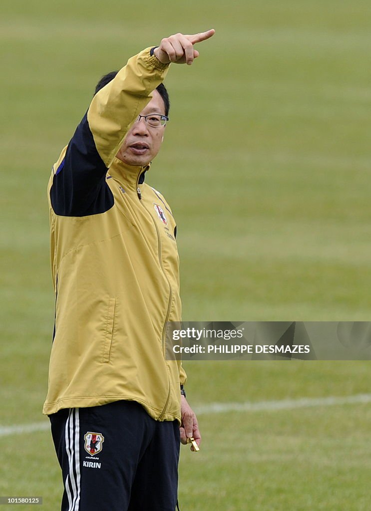 Japan's coach Takeshi Okada gestures dur