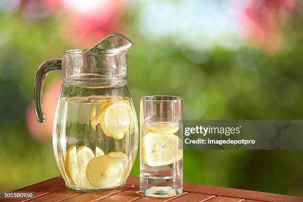 glass pitcher of fresh lemonade - lemon soda stock pictures, royalty-free photos & images