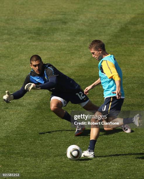 Harry Kewell of Australia gets the ball past goalkeeper Adam Federici during an Australian Socceroos training session at St Stithians College on June...