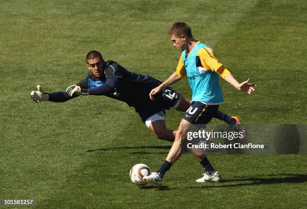 Harry Kewell of Australia gets the ball past goalkeeper Adam Federici during an Australian Socceroos training session at St Stithians College on June...