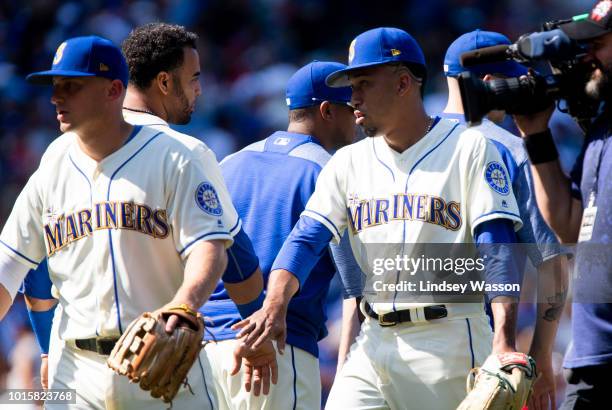 Kyle Seager of the Seattle Mariners, left, Nelson Cruz, center and Edwin Diaz greet each other after their win over the Toronto Blue Jays at Safeco...