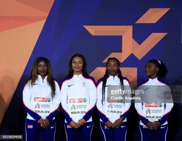 Athletes of England celebrate after winning the golden medal in women's 4x100m relay final during the 2018 European Athletics Championships in...