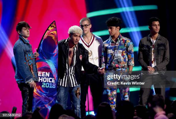 Musical group CNCO accept the Choice Latin Artist award onstage during FOX's Teen Choice Awards at The Forum on August 12, 2018 in Inglewood,...