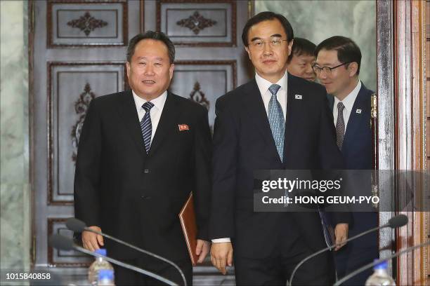 South Korean Unification Minister Cho Myoung-gyun and his North Korean counterpart Ri Son Gwon walk into a meeting room for their talks at the...