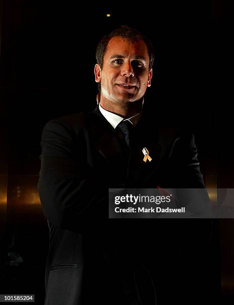 Wayne Carey poses for photos after becoming an inductee of the AFL Hall of Fame at the 2010 Australian Football Hall of Fame induction dinner at...