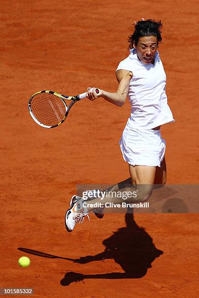 Francesca Schiavone of Italy plays a backhand during the women's singles semi final match between Elena Dementieva of Russia and Francesca Schiavone...