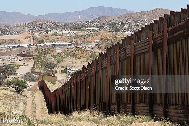 Fence separates the cities of Nogales, Arizona and Nogales, Sonora Mexico, a frequent crossing point for people entering the United States illegally,...