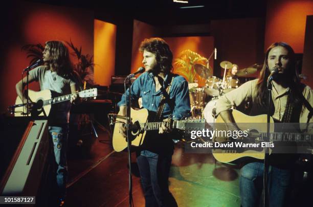 Gerry Beckley, Dan Peek and Dewey Bunnell of America perform on a BBC television show on April 30, 1973.