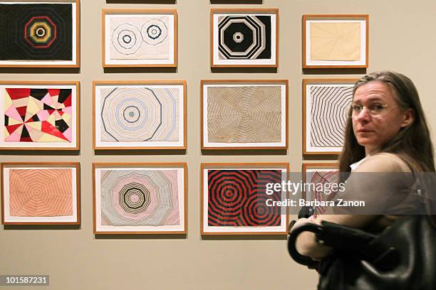 An attendee views works by Louise Bourgeois, during Louise Bourgeois "The fabric works" preview, at Fondazione Emilio Vedova on June 3, 2010 in...