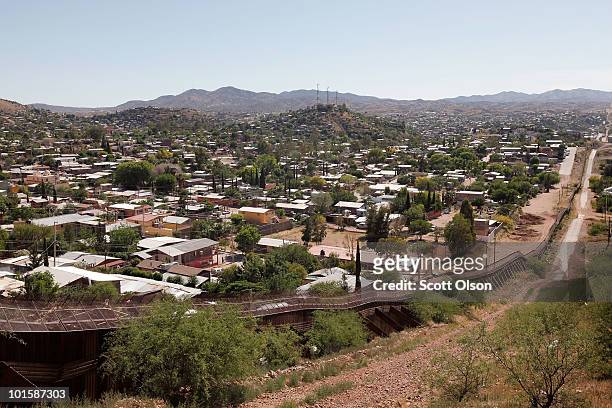 Fence separates the cities of Nogales, Arizona and Nogales, Sonora Mexico, a frequent crossing point for people entering the United States illegally,...