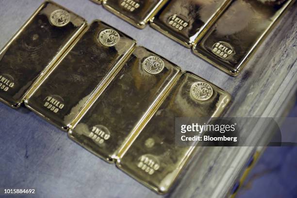 One kilogram gold bars sit on a tray at the Perth Mint Refinery, operated by Gold Corp., in Perth, Australia, on Thursday, Aug. 9, 2018. Demand for...