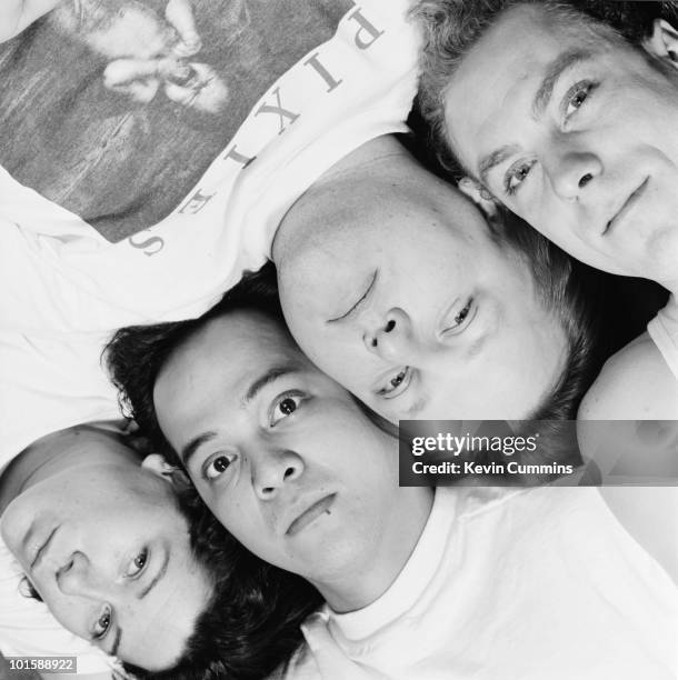 Posed group portrait of American indie band The Pixies. Left to right are bassist Kim Deal, guitarist Joey Santiago, singer Frank Black and drummer...